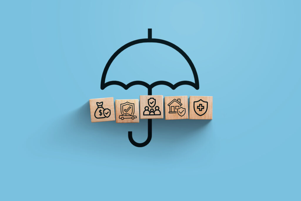 insurance, creative idea. wooden blocks with icons of family, ho